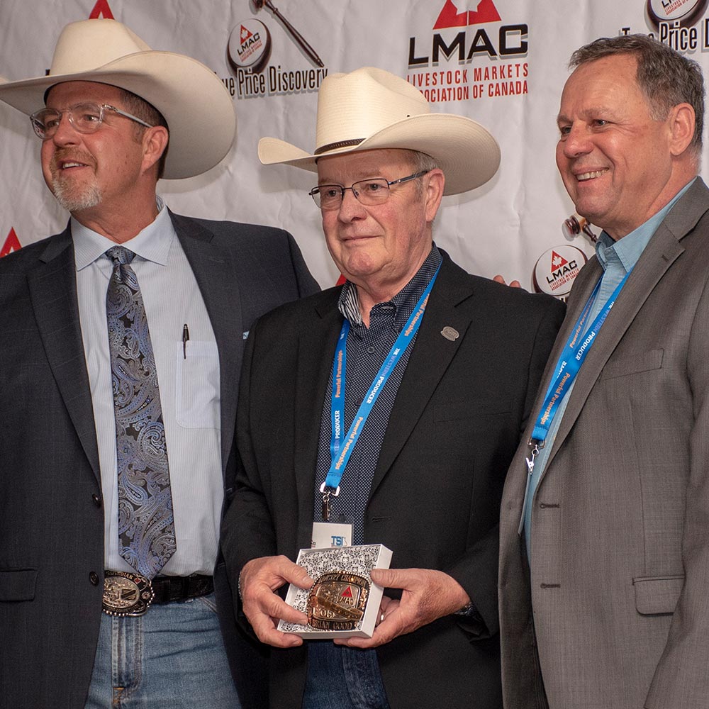 Bob Bergevin and Larry Witzel present the Industry Champion Award to Brian Good at the 2019 LMAC Convention.