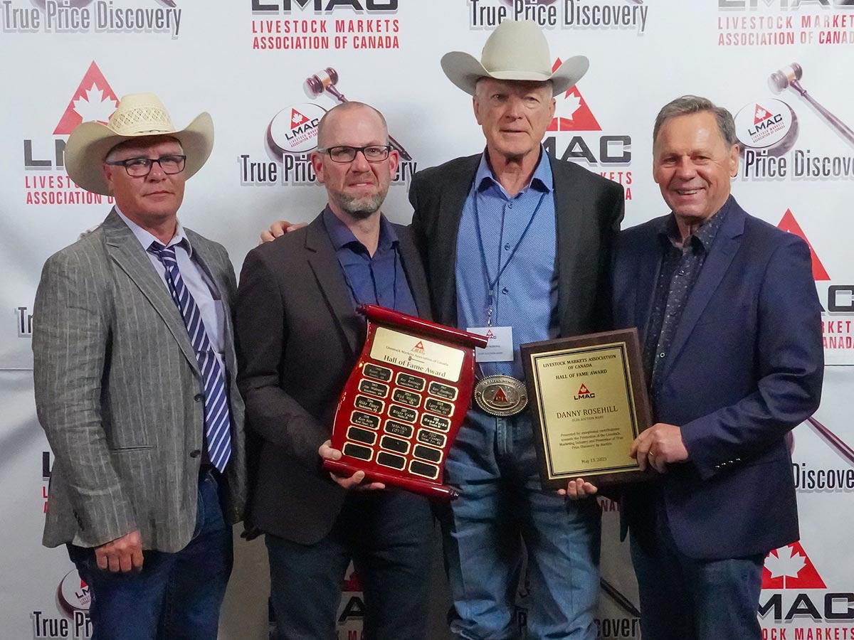 Danny Rosehill (second from right) is inducted into the LMAC Hall of Fame at the 2023 LMAC convention in Olds, Alberta.