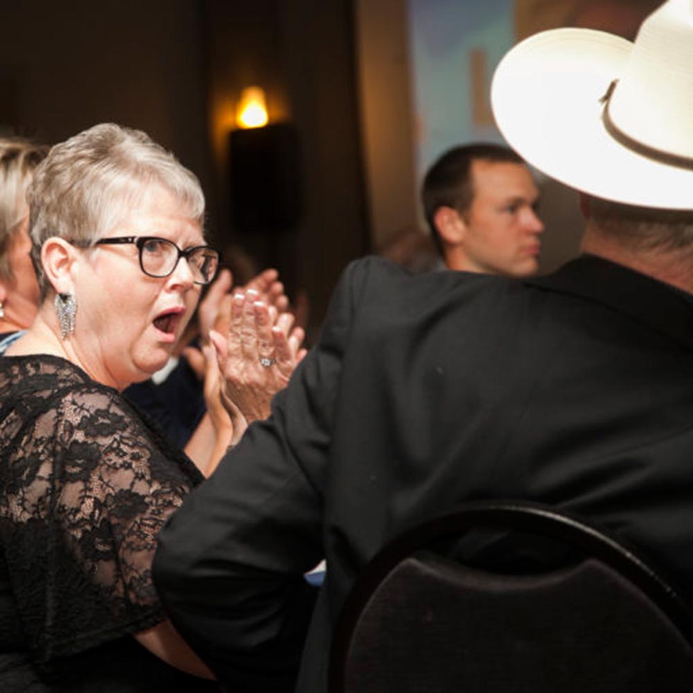 Lynanne Good reacts to her husband, Brian Good, being named the 2019 LMAC Industry Champion at the 2019 LMAC Convention