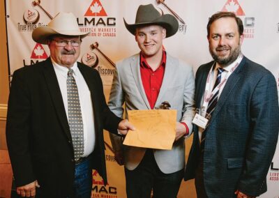 Lars DeLeeuw is awarded the use of an EBY Trailer, presented by Ross Annett of T-Down Trailer Sales and Erin Varley of EBY Trailers.