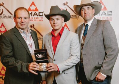 Lars DeLeeuw is awarded the Champion Buckle courtesy of the Canadian Hereford Association, presented by Jamie O'Shea.
