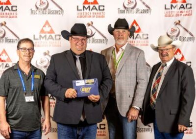 Champion Dave Jacob receives the use of an Eby Stock Trailer for 1 year, presented by Chuck Phelgher, EBY Trailers, center; Ross Annett, T-Down Trailers, right; Gary MacLean, Keldeck Trailers, left.